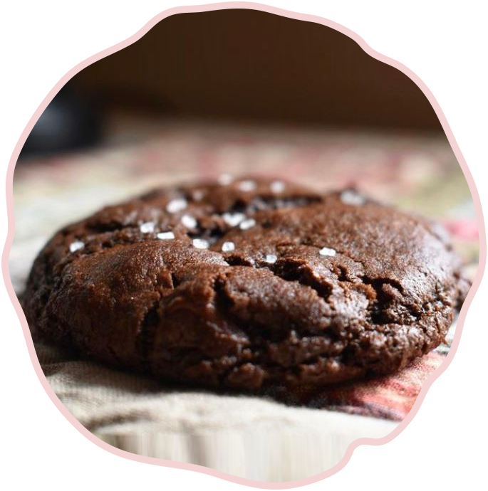 A chocolate cookie with sea salt on top.